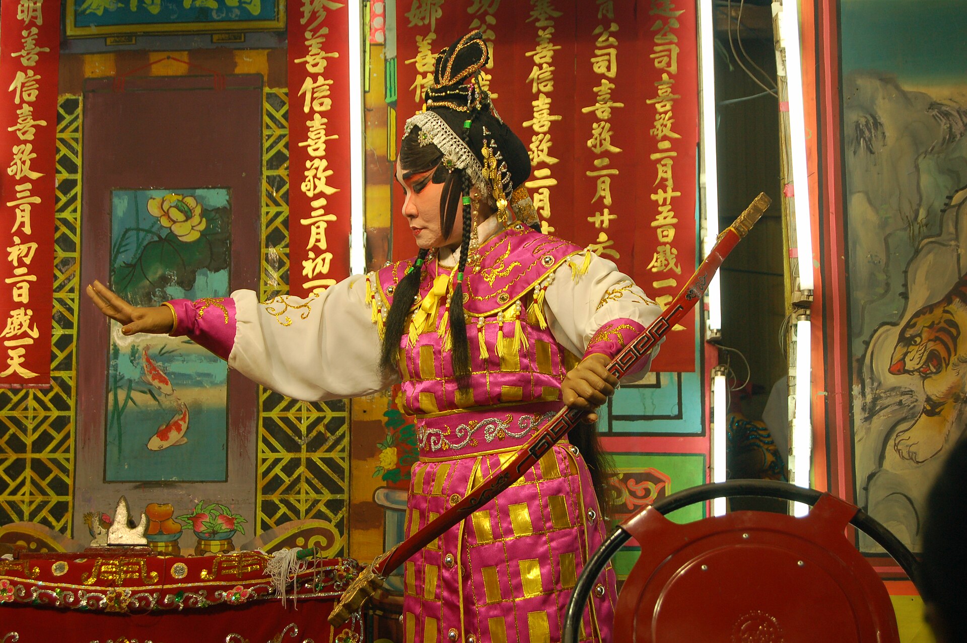 Teochew opera performers in elaborate costumes on a Bangkok stage